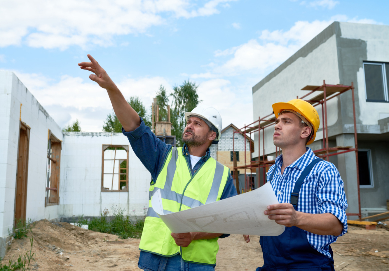 UK housebuilders reviewing construction plans on site